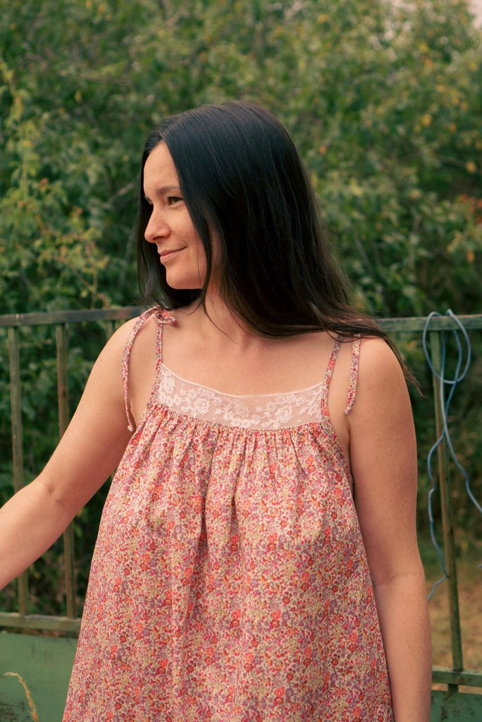 Loïse wearing the Leonie dress with a lace yoke over a gathered edge